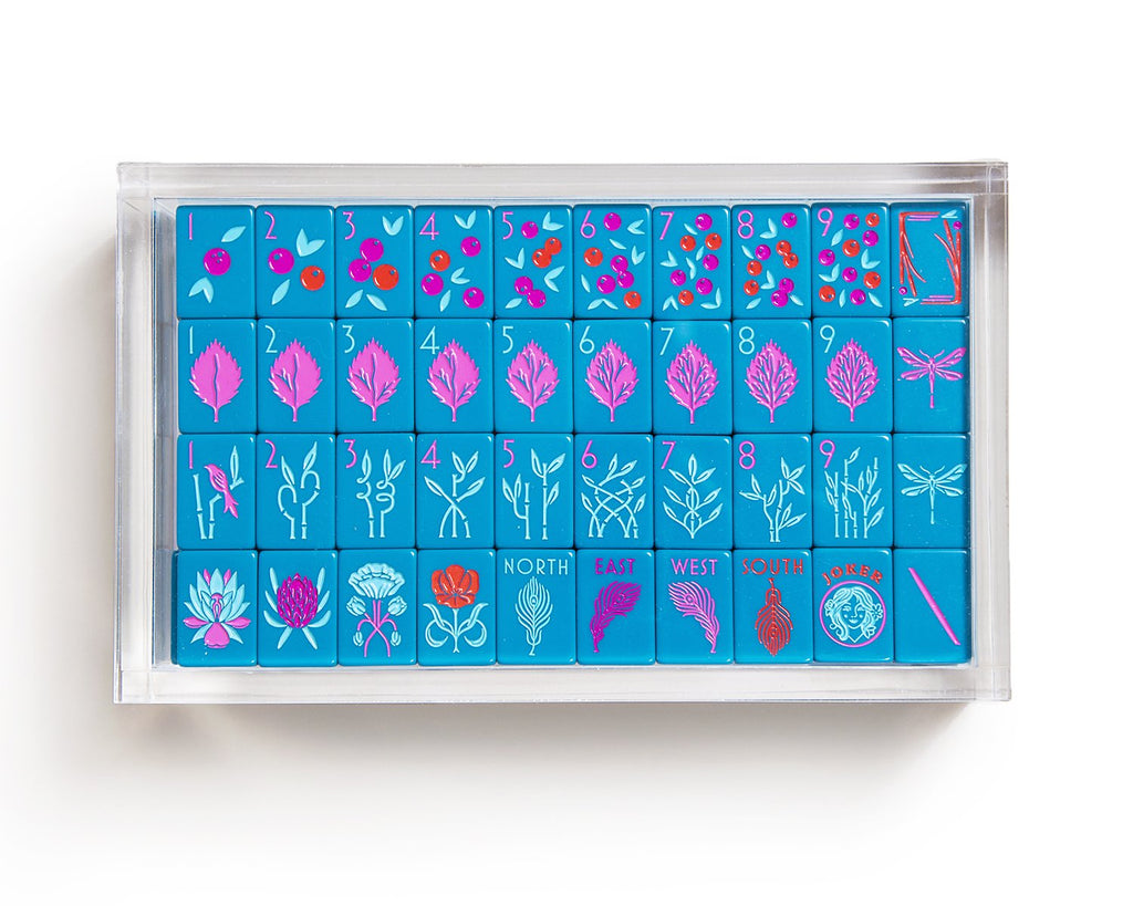 A clear acrylic display box to store The Mahjong Line tile set.