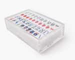 A clear acrylic display box with a removable lid. The acrylic box stores The Mahjong Line mahjong tile set.
