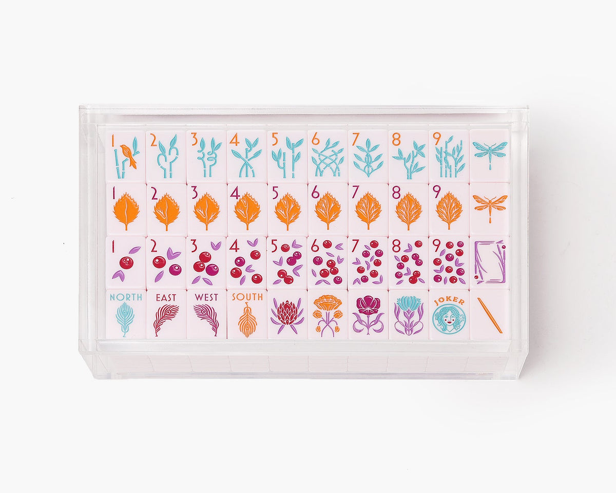 A clear acrylic display box with a removable lid. The acrylic box stores The Mahjong Line mahjong tile set.