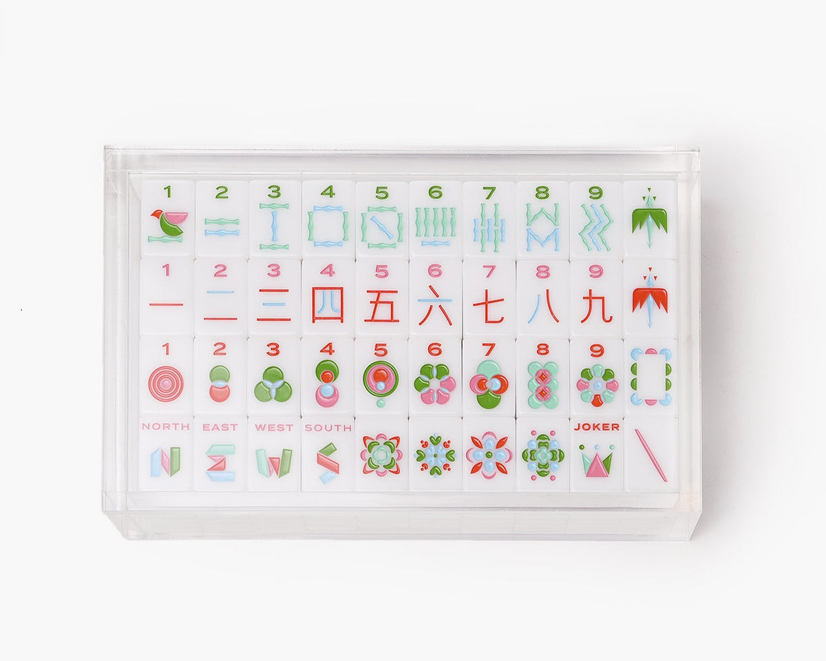 A clear acrylic display box with a removable lid. The acrylic box stores The Mahjong Line mahjong tile set.