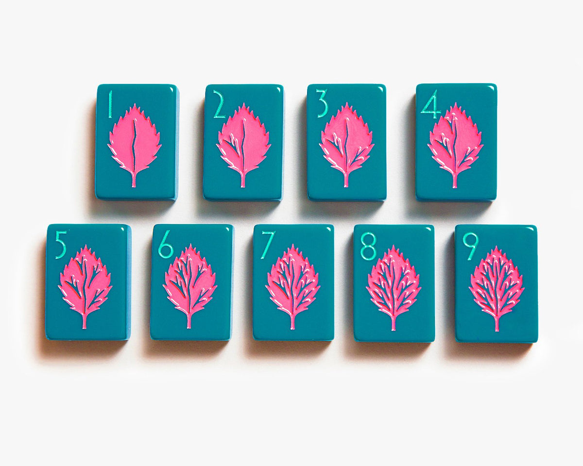 American Mahjong Tile Set to play the game of mahjong. Custom mahjong cracks tiles is from the botanical line featured in a deep teal.