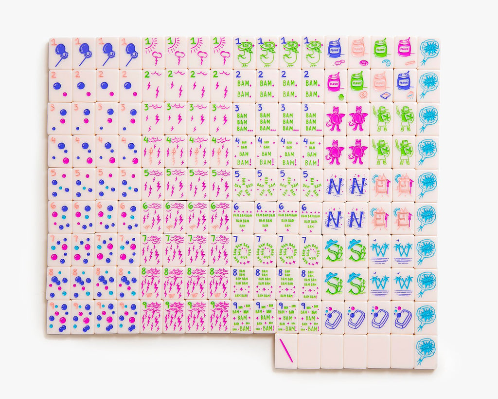 American Mahjong Tile Set to play the game of mahjong. This custom full mahjong set is called the cheeky line featured in a millennial pink. This set has more blanks.