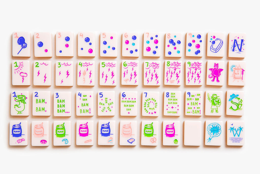 American Mahjong Tile Set to play the game of mahjong. This custom mahjong set is called the cheeky line featured in a millennial pink. 