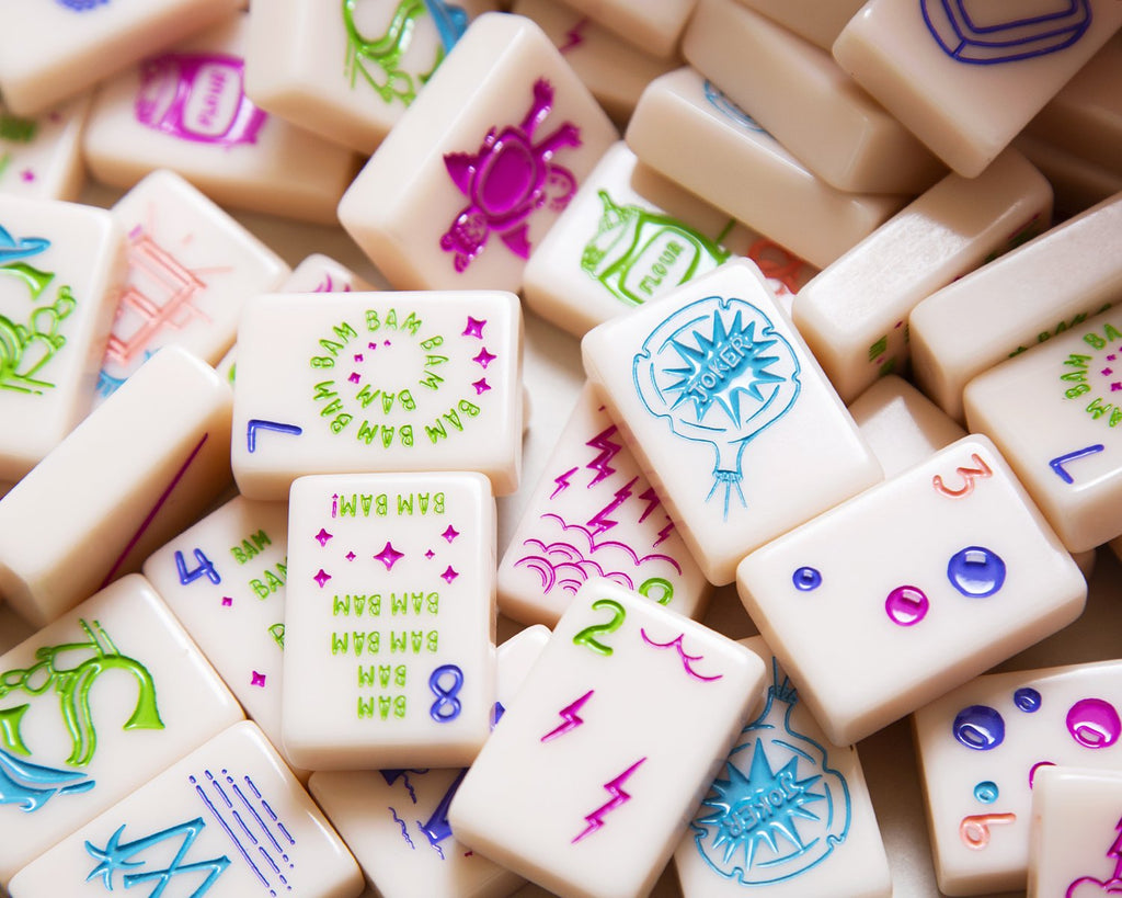 American Mahjong Tile Set to play the game of mahjong. This custom mahjong set is called the cheeky line featured in a millennial pink. 