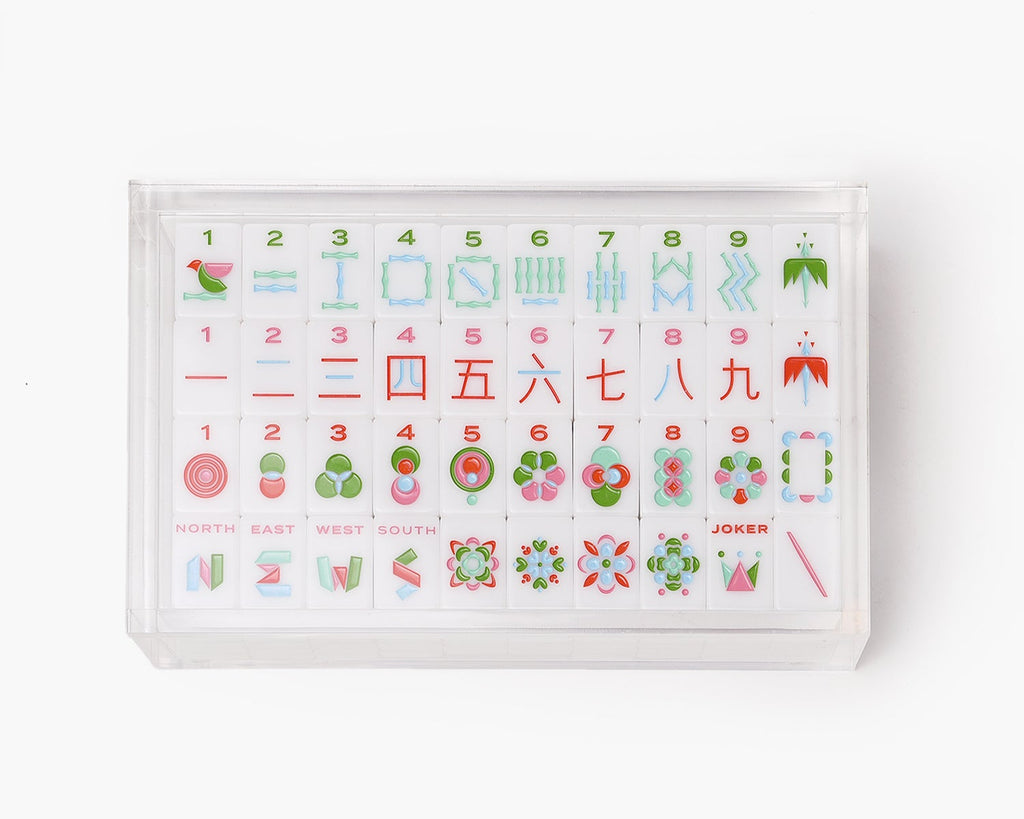 A clear acrylic display box with a removable lid. The acrylic box stores The Mahjong Line mahjong tile set. 