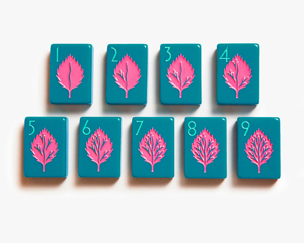American Mahjong Tile Set to play the game of mahjong. Custom mahjong cracks tiles is from the botanical line featured in a deep teal.