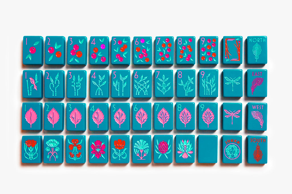 American Mahjong Tile Set to play the game of mahjong. Custom mahjong set is called the botanical line featured in a deep teal.