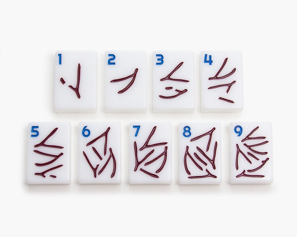 The Mahjong Line releases a new American mahjong tile set called the Joshua Tree. The mah jongg tiles are white tile and the cracks are wishbones.