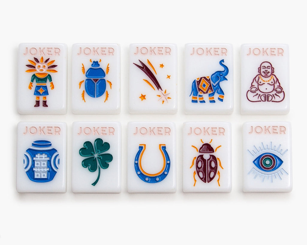The Mahjong Line releases a new American mahjong tile set called the Joshua Tree. The mah jongg tiles are white tile. The jokers are a variety of items such as elephants, Beatles, Indian, Buda, Chinese jar, four leaf clover, horseshoe and evil eye.