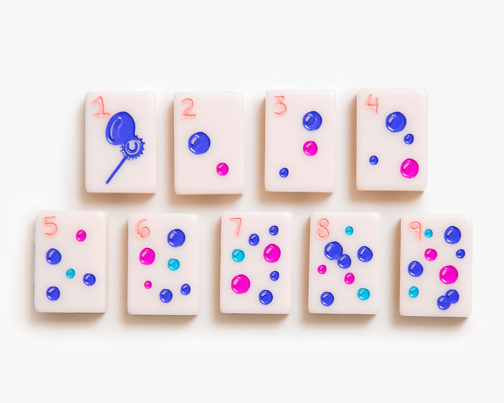 American Mahjong Tile Set to play the game of mahjong. This custom mahjong dot tiles is from the cheeky line featured in a millennial pink.