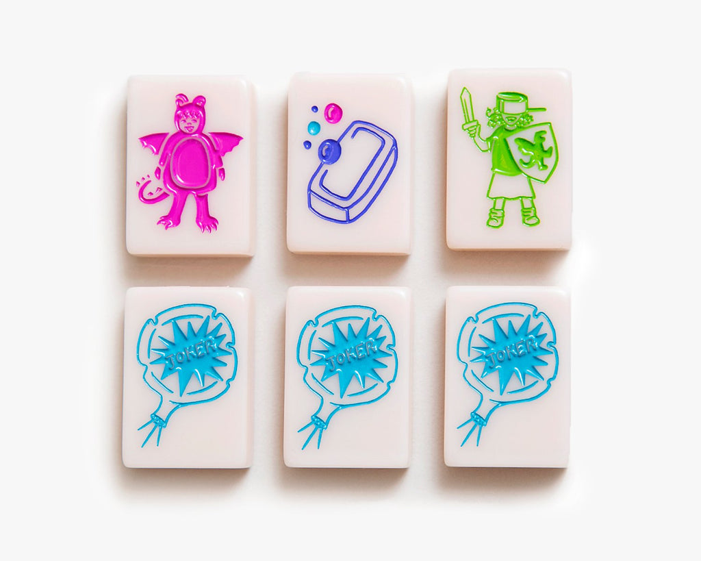 American Mahjong Tile Set to play the game of mahjong. This custom mahjong dragon and joker tiles is from the cheeky line featured in a millennial pink.