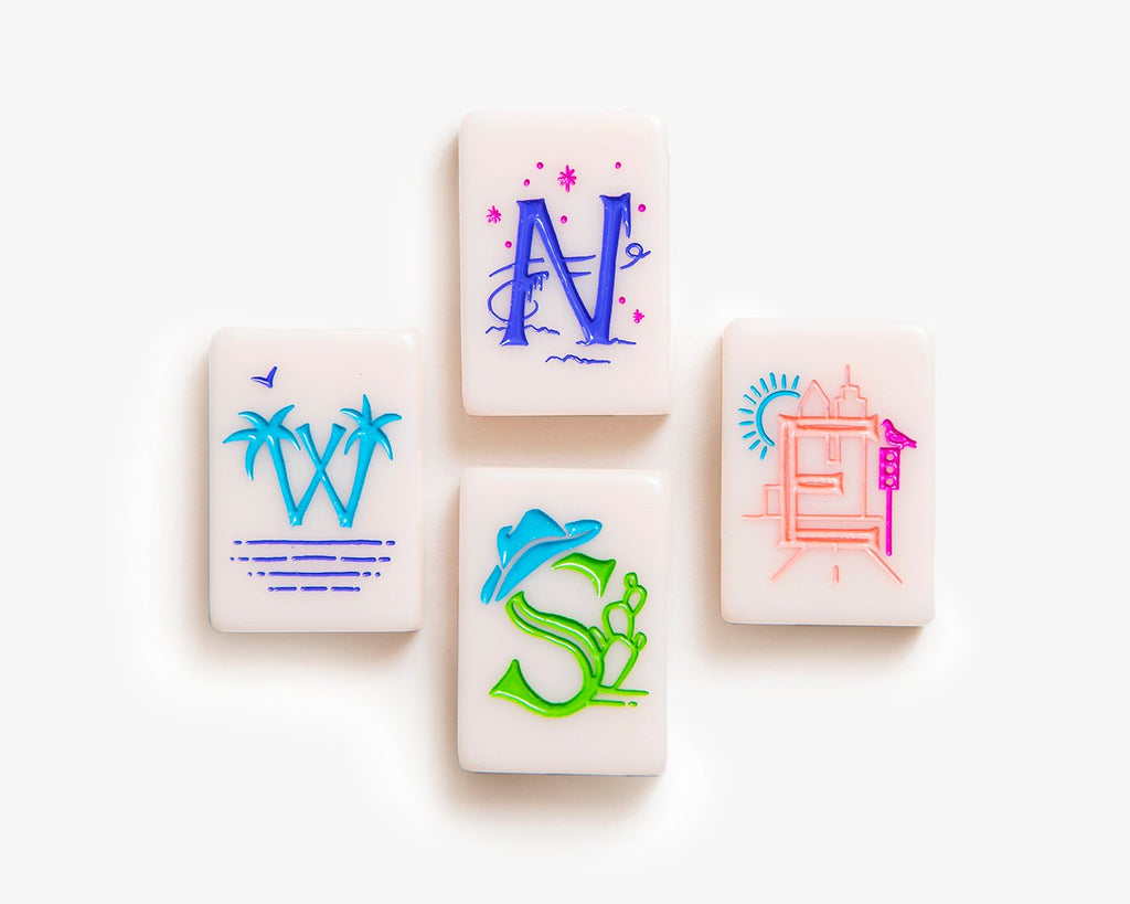 American Mahjong Tile Set to play the game of mahjong. This custom mahjong wind tiles is from the cheeky line featured in a millennial pink.